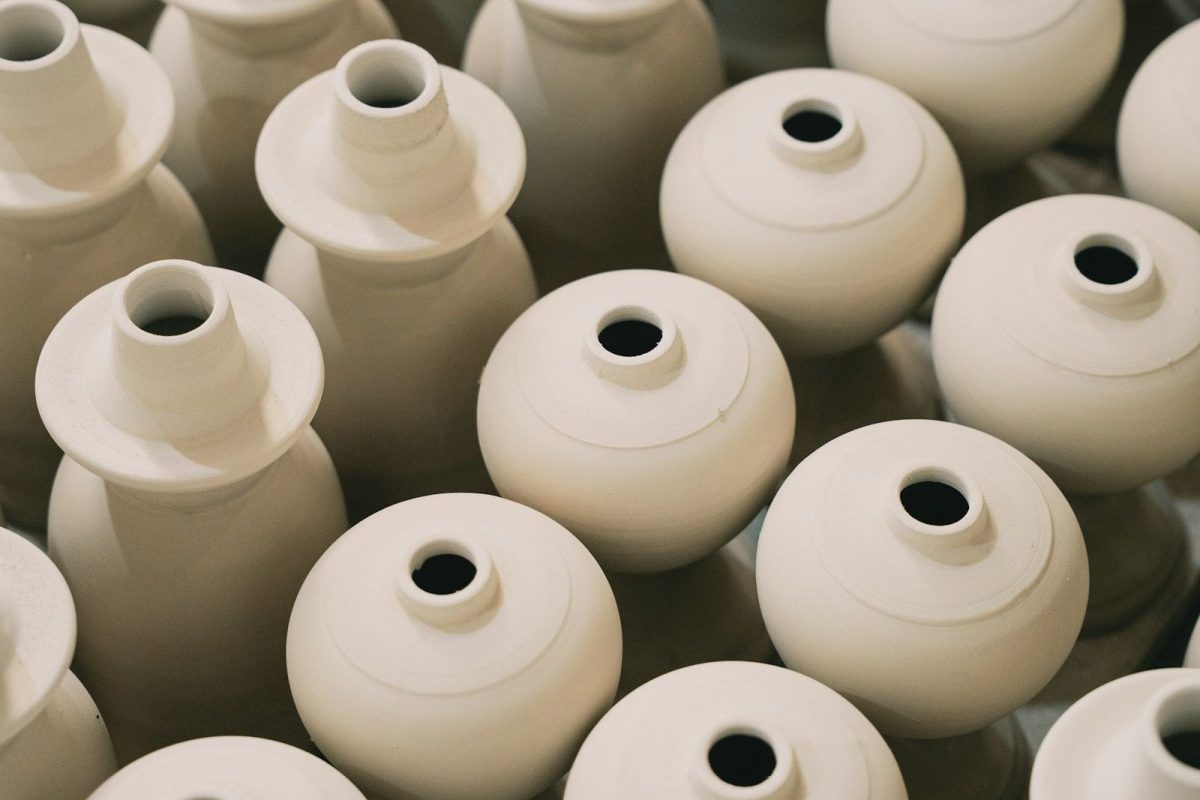Rows of white stoneware vases